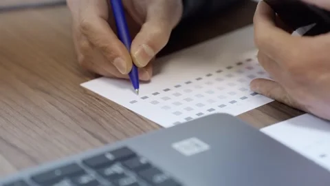 Graphic designer checks print pattern quality on desk. Focus on a graphic des Stock Footage 280191717