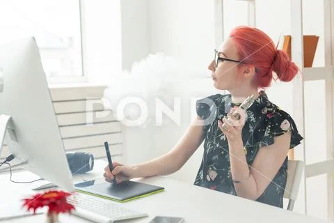 Graphic designer concept - Female graphic designer working on computer while Stock Photos