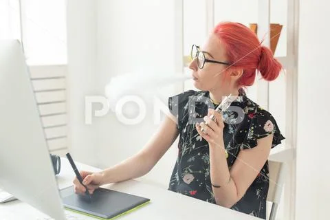 Graphic designer concept - Female graphic designer working on computer while Stock Photos