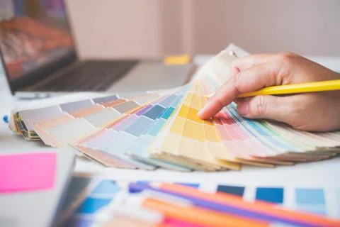 The graphic designer creative team is currently working on the design and col Stock Photos