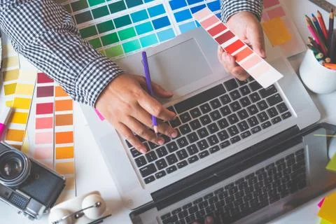 The graphic designer creative team is currently working on the design and col Stock Photos