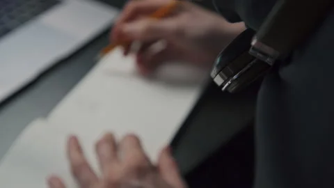 A graphic designer draws a prototype of an icon visual with a pencil on paper Stock Footage 172527426