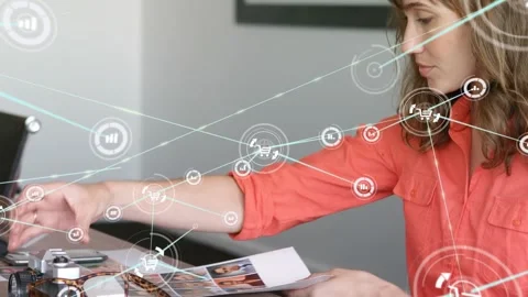 Graphic designer examines global tech design on her computer in an office. Stock Footage 329422485