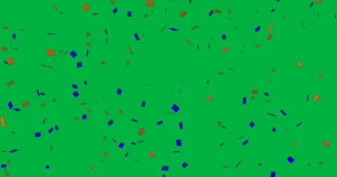Graphic designer manipulating floating orange and blue confetti shapes on Stock Footage 317595326