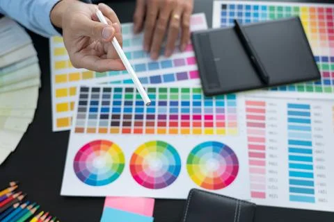 Graphic designer or creative working together coloring using graphics table.. Stock Photos