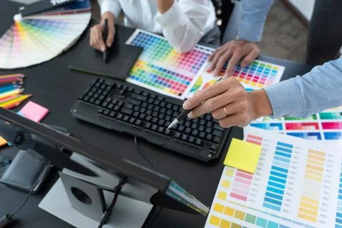 Graphic designer or creative working together coloring using graphics table.. Stock Photos