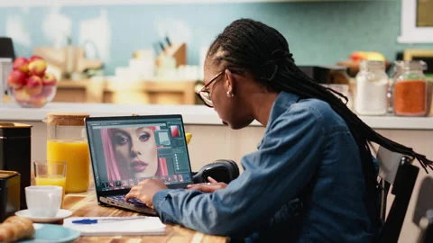 Graphic designer photo editor checking visual content on laptop Stock Footage 344246597