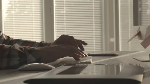 Graphic designer typing on computer keyboard Stock Footage 63624557