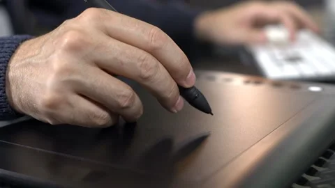 Graphic Designer Using Digital Tablet and Pen Stock-Footage 200708669