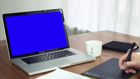 Graphic designer using digitizer at his desk in creative office Stock Footage 81879324