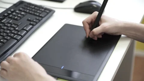 Graphic designer using drawing tablet Stock Footage 76195935