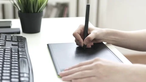 Graphic designer using drawing tablet Stock Footage 76195997