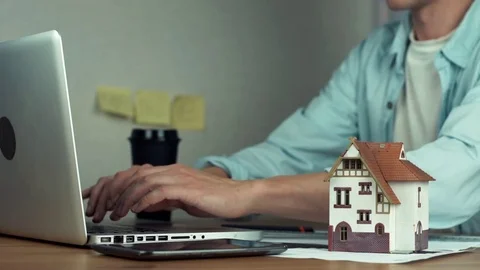 Graphic designer using graphic tablet creating housing project on laptop Stock Footage 81881936
