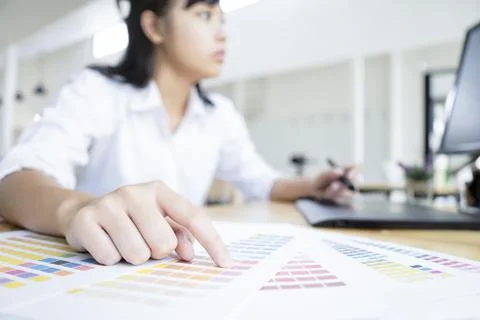 Graphic designer using graphics tablet and computer in the office Stock Photos