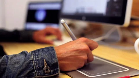 Graphic designer using a tablet mouse at the studio Stock Footage 232926037