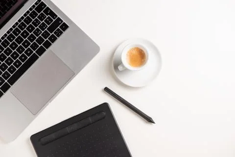 Graphic Designer white work table with computer and coffee. Stock Photos