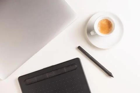 Graphic Designer white work table with computer and coffee. Stock Photos
