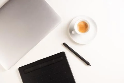 Graphic Designer white work table with computer and coffee. Stock Photos