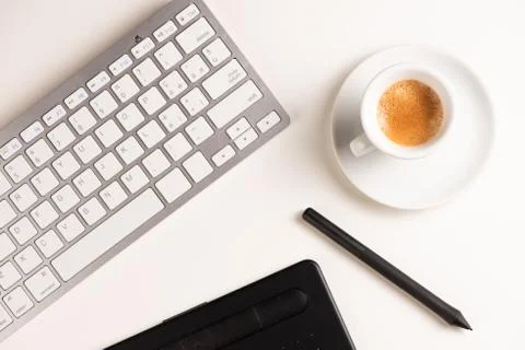Graphic Designer white work table with computer and coffee. Stock Photos