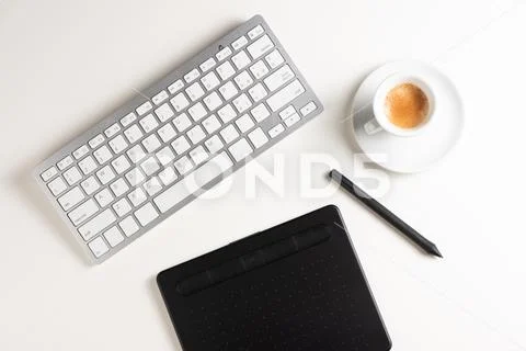Graphic Designer white work table with computer and coffee. Stock Photos