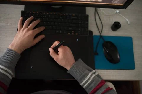 Graphic designer at work top view Young graphic designer working on a digi... Stock Photos