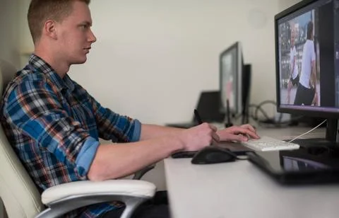 Graphic designer at work Young graphic designer working on a digital table... Stock Photos