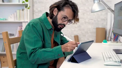 Graphic designer working with computer digital tablet stylus pen smartphone at Stock-Footage 230016515