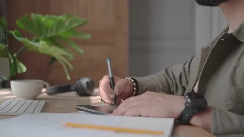 Graphic designer working at a computer with a drawing tablet Stock Footage 137232559