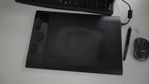 Graphic designer working on digitizer at her desk in creative office Stock Footage 144540453