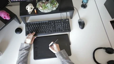 Graphic designer working on digitizer at her desk in creative office Stock Footage 144554434