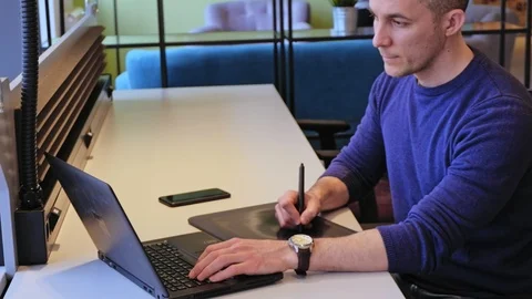 Graphic designer working with drawing tablet Stock Footage 94727587