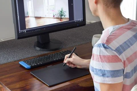 Graphic designer working with graphic tablet Stock Photos