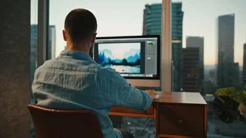Graphic designer working from home on computer, view of Downtown LA Vídeos de archivo 127402169