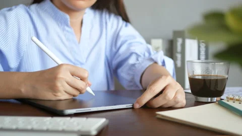 Graphic designer working with interactive stylus pen, drawing design on tablet Stock Footage 151264919