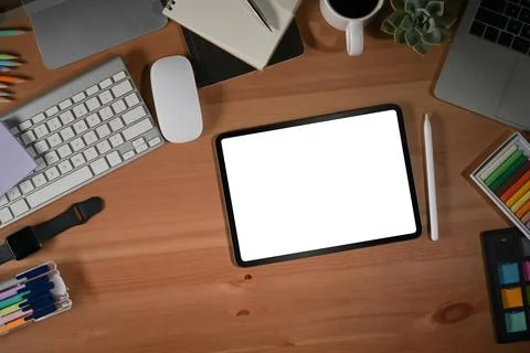Graphic designer workplace with digital tablet, computer and stationery on Stock Photos