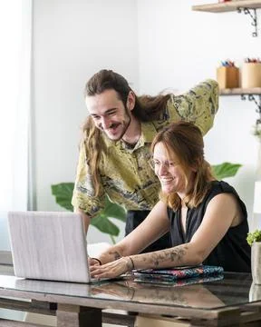 Graphic designers using tablets and working together in workplace Stock Photos
