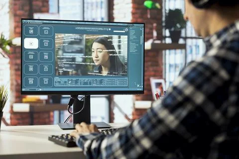 Graphic editor at workstation arranging interface elements in PC software Stock Photos