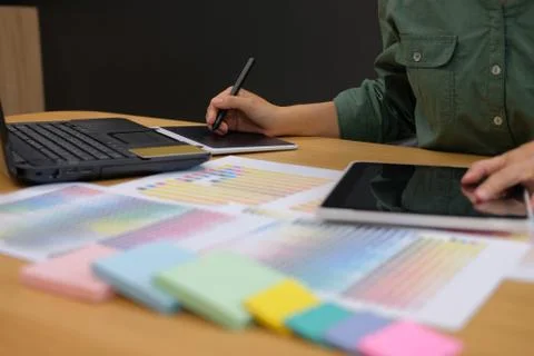 Graphic interior designer working with tablet. creative man drawing with styl Stock Photos