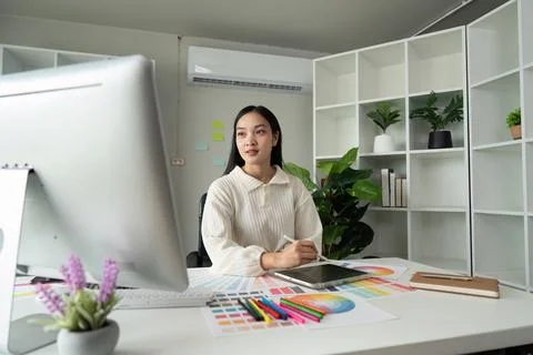 Graphic or UI designer work on computer laptop and with tablet after Stock Photos