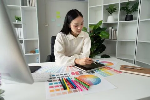 Graphic or UI designer work on computer laptop and with tablet after Stock Photos
