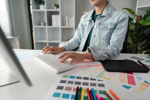 Graphic or UI designer work on computer laptop and with tablet after Stock Photos