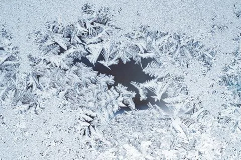 Graphic pattern on the frosted winter window Stock Photos