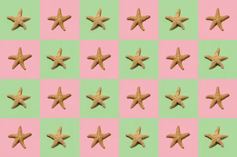 Graphic pattern of starfish on yellow and pink background Stock Photos