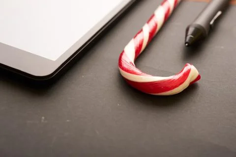 Graphic tablet and candy cane Stock Photos