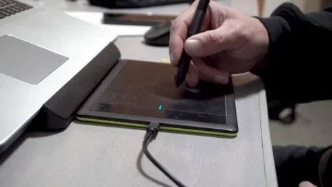 Graphic tablet and hand 4K Stock Footage 325988485