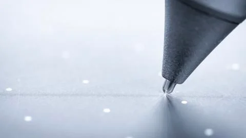 Graphic tablet pen on the surface of the device, close-up photo. Stock Photos
