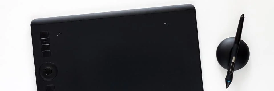 Graphic tablet on a white empty background. Computer graphics desk. Panorama Stock Photos