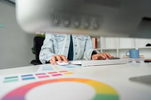 Graphic UI designer work on computer laptop and with graphic, working after Stock Photos