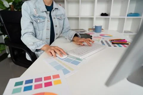 Graphic UI designer work on computer laptop and with graphic, working after Stock Photos