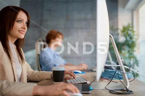 Graphic woman designer at work working on computer for new project. Stock Photos